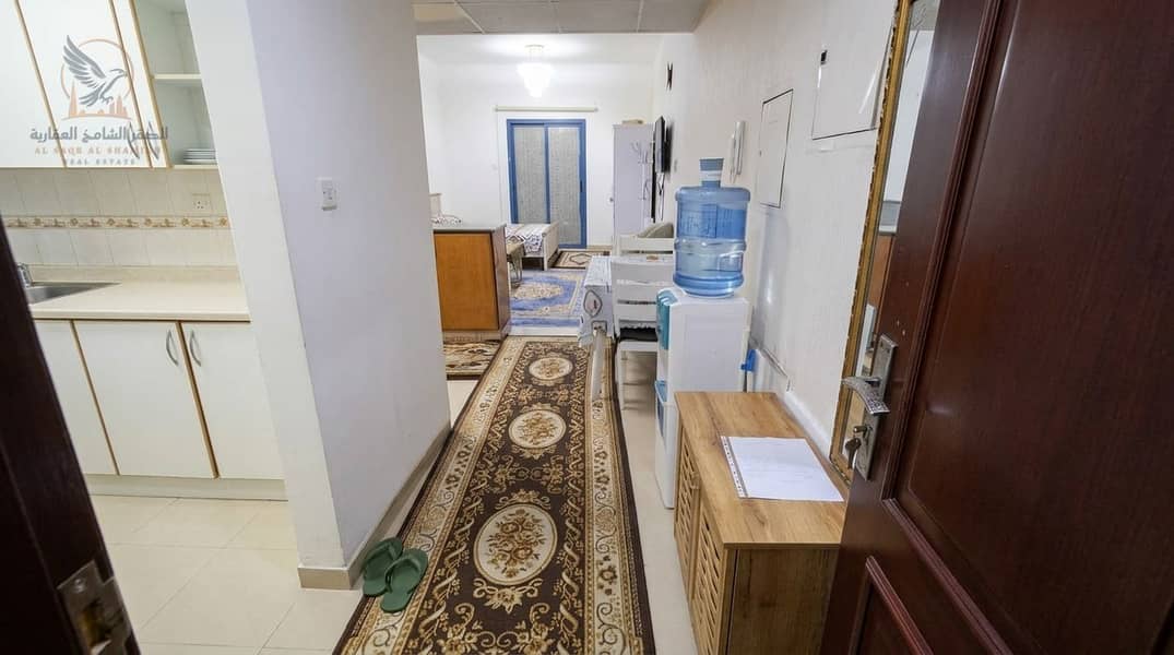 6 استوديو مفروش للإيجار السنوي في عجمان برج النعيمية سي مع بلكون وإطلالة مفتوحة وباركن خاص (8). jpeg