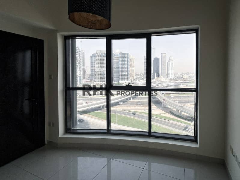 8 Panoramic Sheikh Zayed Road skyline view from high-floor apartment window in Dubai