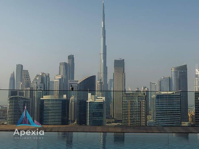 14 04-see-the-skyline-of-dubai-and-the-iconic-burj-khalifa-from-the-pool. jpg