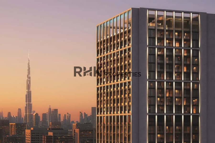 Luxury residential tower with Burj Khalifa view at sunset Business Bay Dubai Luxury residential tower with Burj Khalifa view at sunset Business Bay Dubai