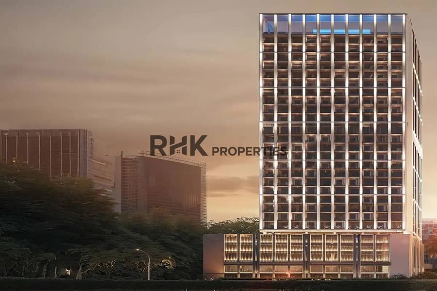 11 Modern high-rise residential tower with illuminated facade at dusk Dubai