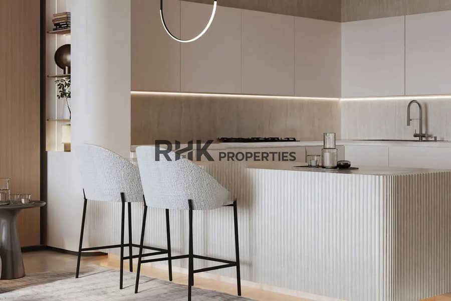 8 Minimalist kitchen with fluted white island boucle bar stools and under-cabinet lighting Dubai