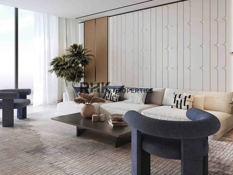 2 Bright apartment living room with floor-to-ceiling windows scallop wall panels and sectional sofa Dubai