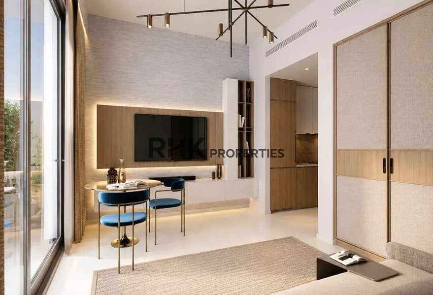 4 Modern apartment living room interior with wooden TV unit blue velvet dining chairs and floor-to-ceiling windows Dubai