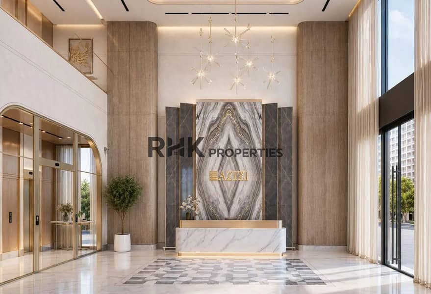 8 Azizi Developments luxury lobby interior with marble reception desk gold accents and designer chandelier Dubai