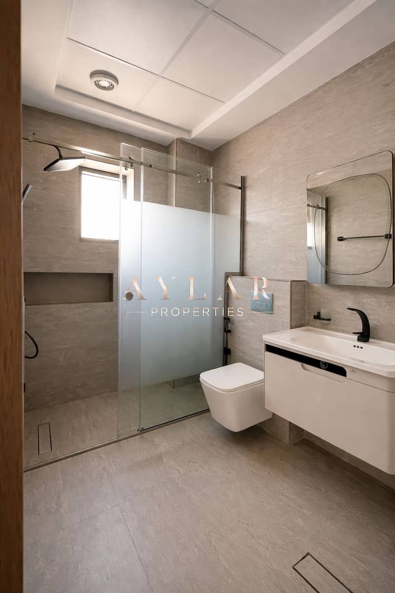 16 Modern bathroom with frosted glass shower. png