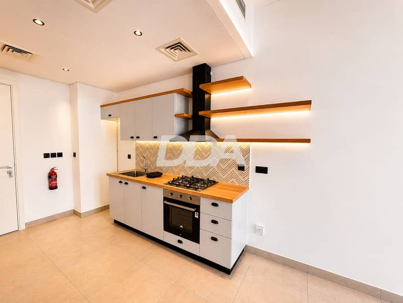 4 socio-tower-b-studio-open-plan-kitchen-living-area-01. png