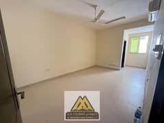 Large ground-floor studio in Al Rawda 3, split AC, semi-open kitchen, AED 18K, 4 payments.