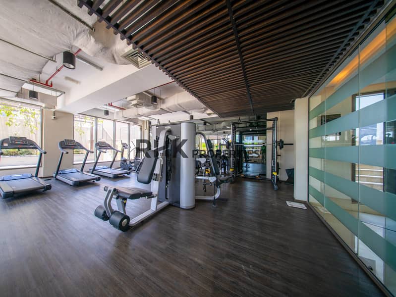 6 Fully equipped residential gym with cardio machines, strength equipment and modern workout space
