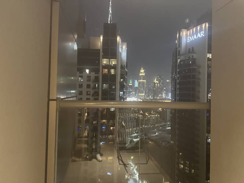 15 1319 Elite Downtown R1 Living Room Balcony 1. jpeg