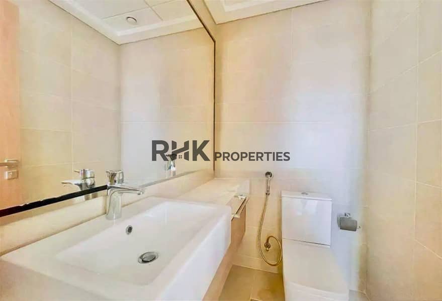 9 Modern bathroom with vanity sink and mirror in a furnished studio apartment in Meydan Dubai