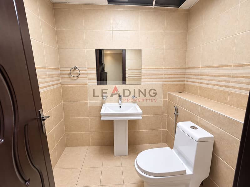 15 Polished Beige Tile Bathroom. png