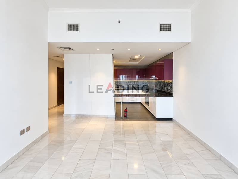 8 Polished Empty Interior With Burgundy Kitchen. png