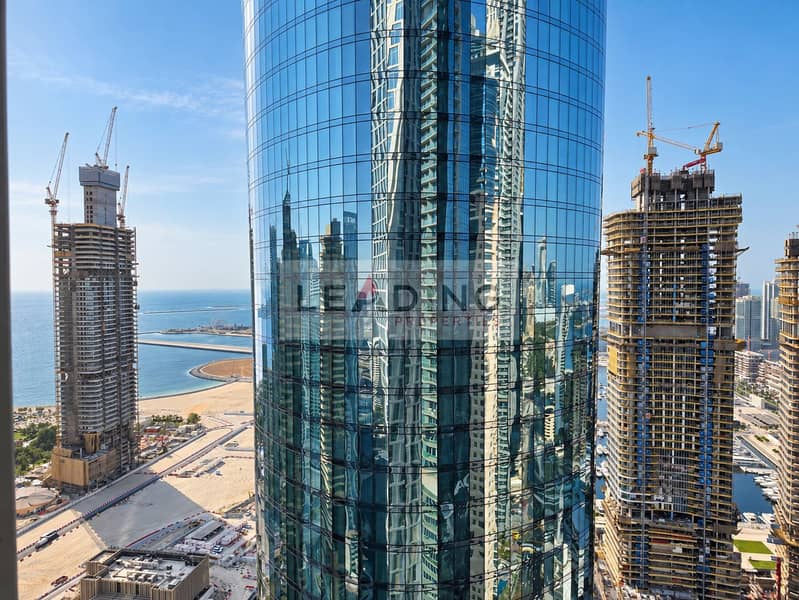 13 Curved Glass Tower Along the Shoreline. png