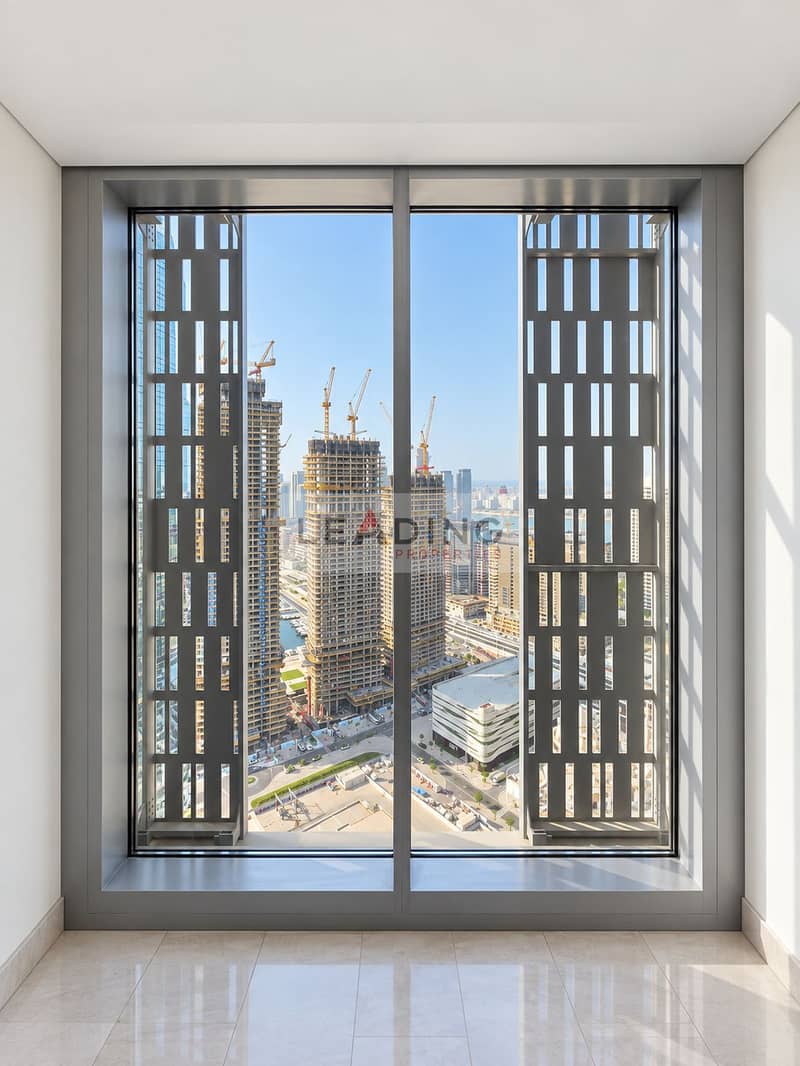 25 Pristine showroom overlooking cranes and water. png