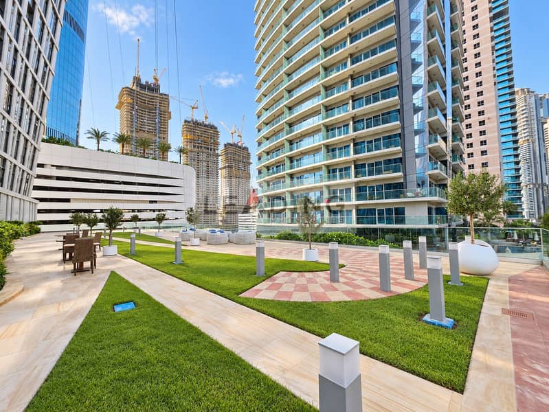 27 Polished courtyard amid tower construction. png