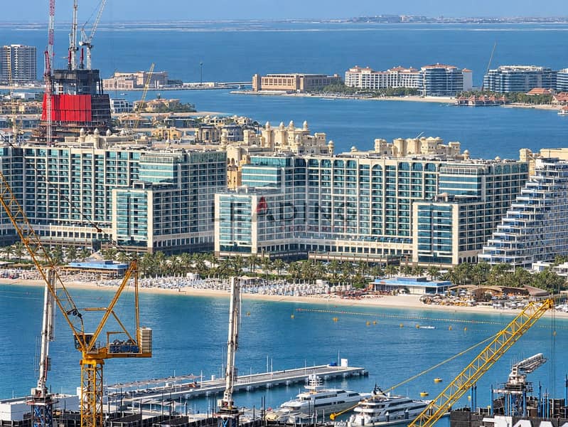 37 Sunlit Waterfront Marina with Cranes and Yachts. png