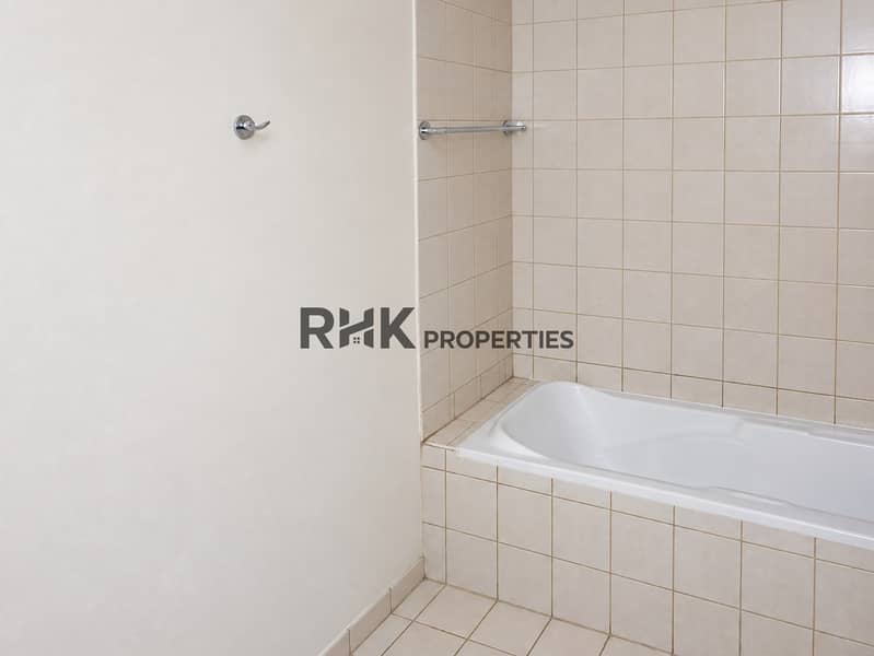 11 Brightened bathroom tub view