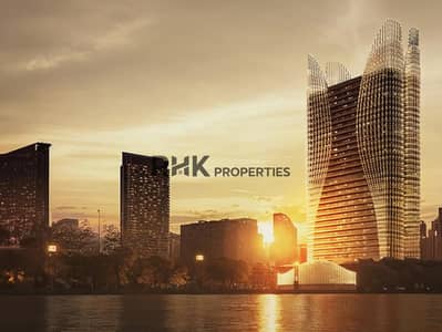 商业湾， 迪拜 单身公寓待售 - Ultra-luxury skyscraper with organic wavy glass facade reflecting golden sunset over Dubai Creek waterfront