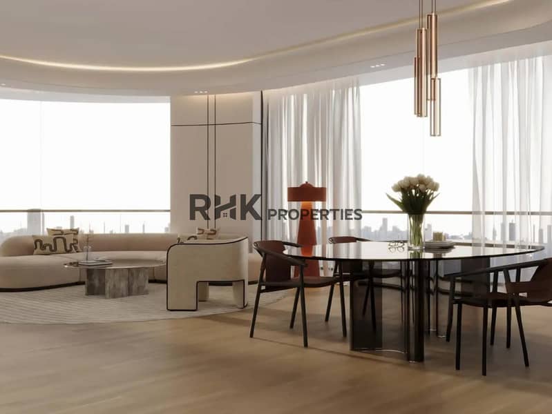 4 Luxury apartment open-plan living and dining room with curved ceiling cove lighting, panoramic Dubai skyline views and smoked glass dining table