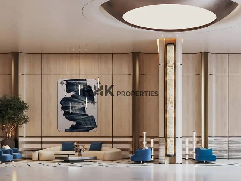 11 Luxury apartment tower grand lobby reception with backlit onyx column, circular cove ceiling, timber feature walls and blue accent seating in Dubai