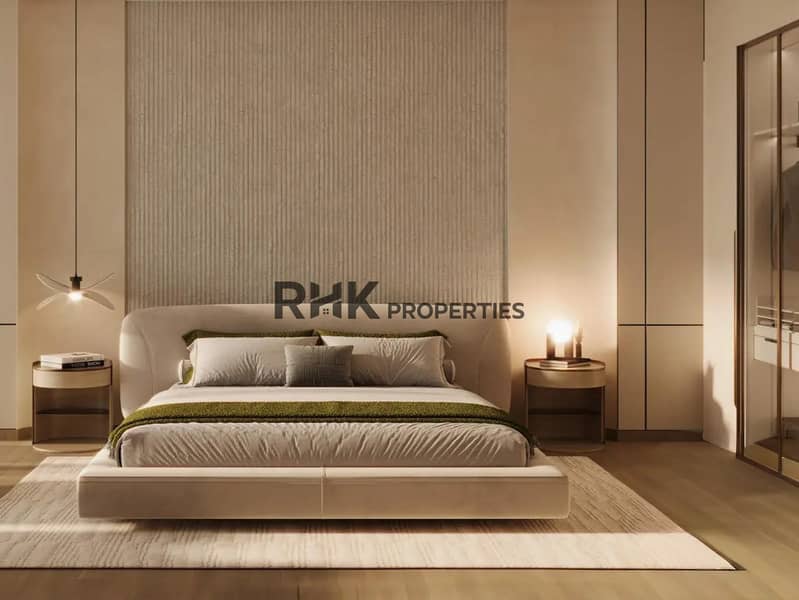 8 Luxury master bedroom with upholstered platform bed, ribbed plaster accent wall, warm ambient lighting and walk-in wardrobe in Dubai high-rise apartment