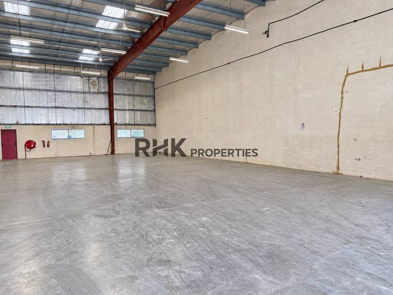 3 Bright industrial warehouse unit with high ceilings, spacious concrete floor and large loading entrance.