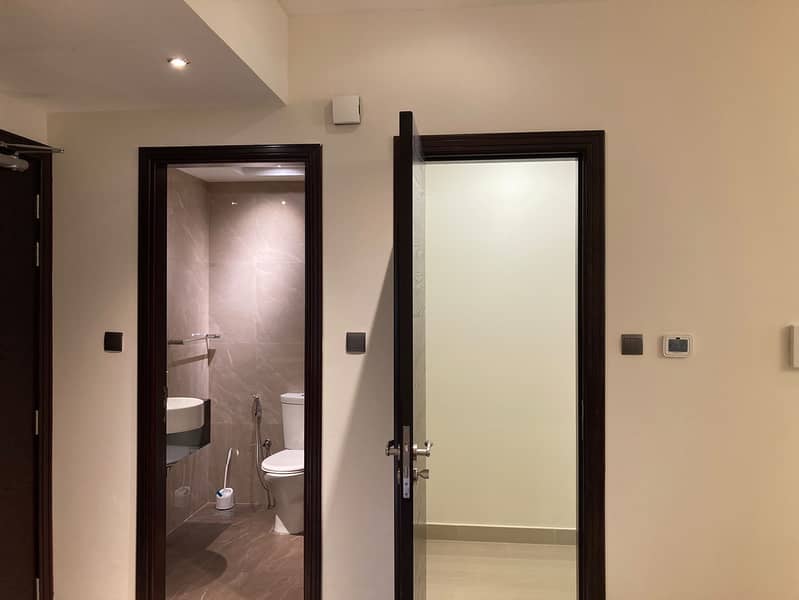 24 204 Elite Downtown Residence King Bedroom Bathroom 3. jpeg