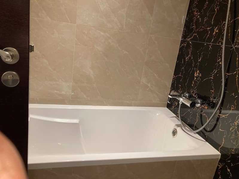 27 204 Elite Downtown Residence King Bedroom Bathroom 2. jpeg