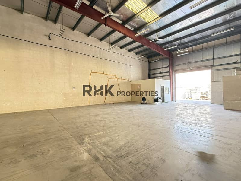 4 Warehouse interior with high roof, office enclosure and loading entrance in DIP 2