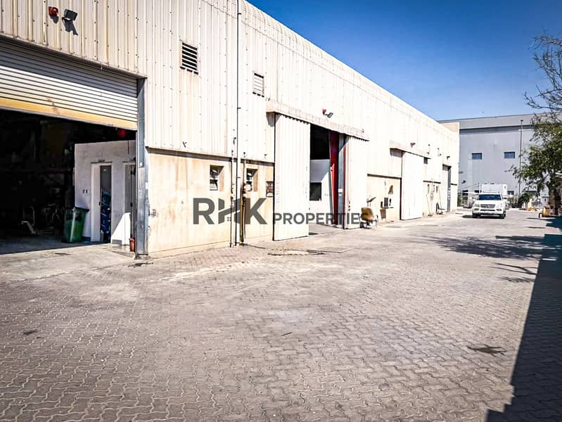 6 Industrial warehouse exterior with loading access in Dubai Investment Park 2