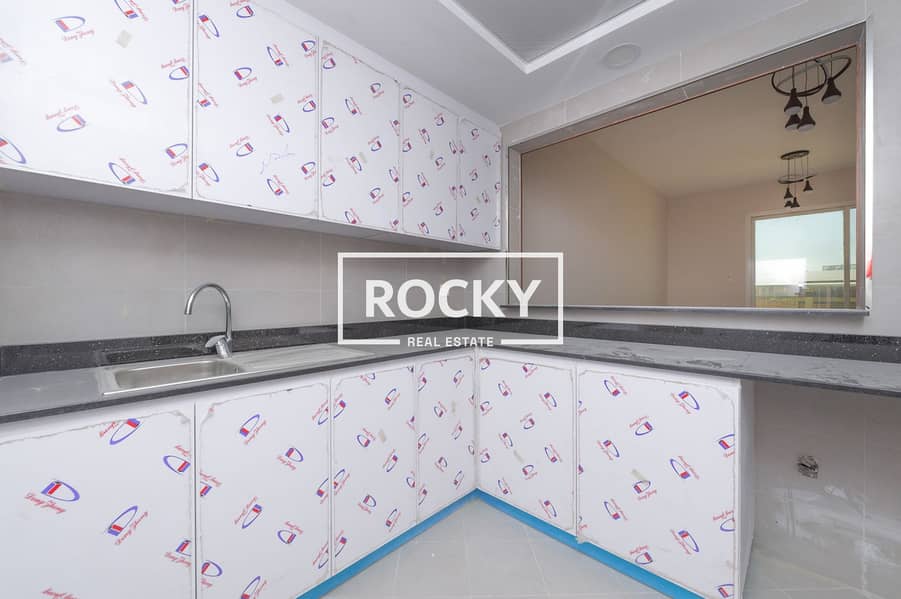 9 Rocky Real Estate - International City - Amna Res. - Apartment (6 of 17). JPG