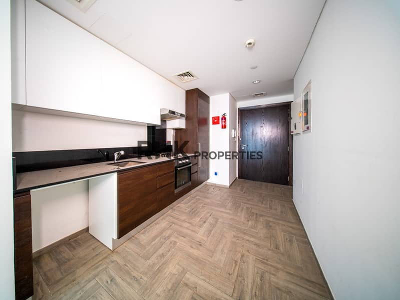 5 Modern open kitchen with built-in appliances, sleek cabinetry and contemporary finishes