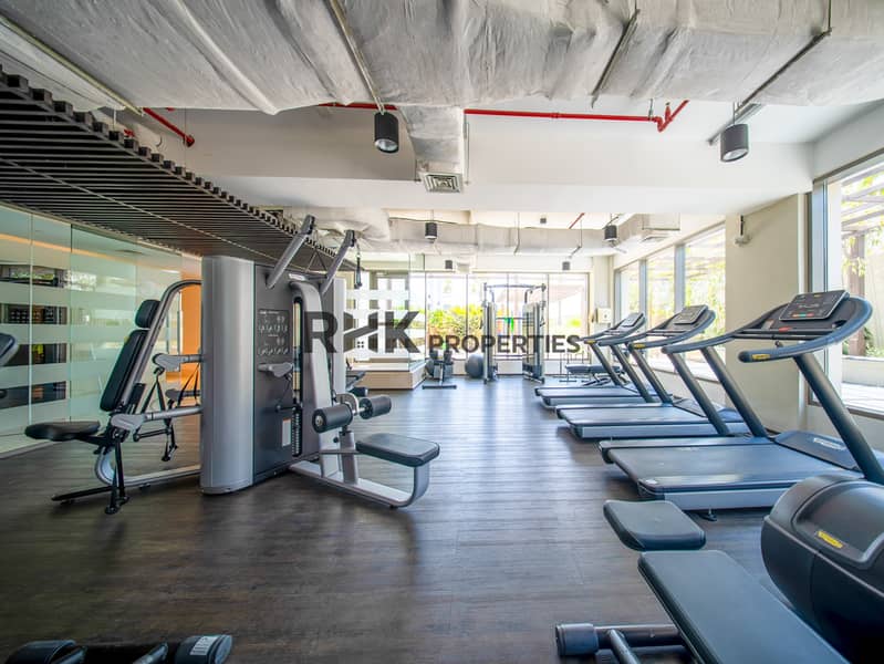 11 Luxury apartment gym with treadmills, weight machines and spacious fitness facilities