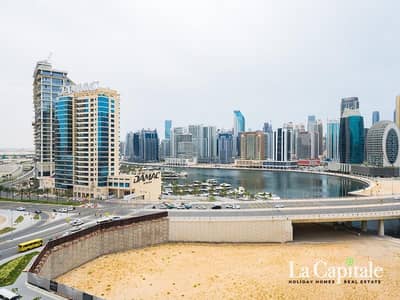 فلیٹ 2 غرفة نوم للايجار في الخليج التجاري، دبي - شقة في الخليج،الخليج التجاري 2 غرف 130000 درهم - 16609945