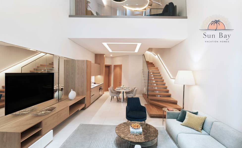 4 Inspired Living One Bedroom King Loft Living Area. jpg
