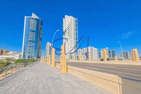 1 Спальня Апартаменты Продажа в Остров Аль Рим, Абу-Даби - Modern urban landscape under clear skies. png
