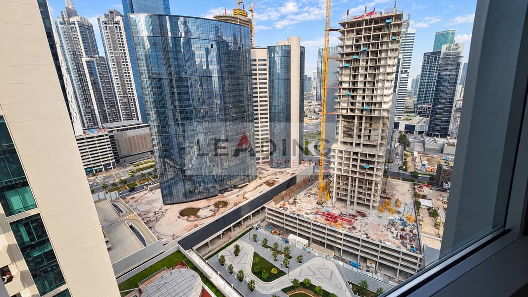 12 Refined cityscape with cranes and towers. png