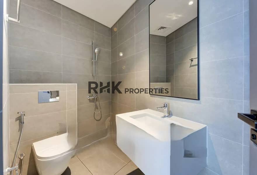 8 Modern luxury townhouse bathroom with walk-in shower, wall-mounted toilet and contemporary vanity