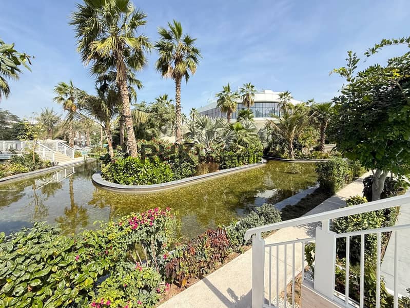 12 Landscaped luxury townhouse community with tropical gardens, palm trees and decorative water features