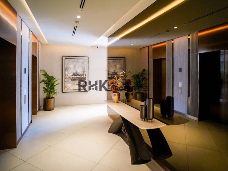 19 Elegant elevator lobby with marble console table and artwork at Floarea Residence Dubai