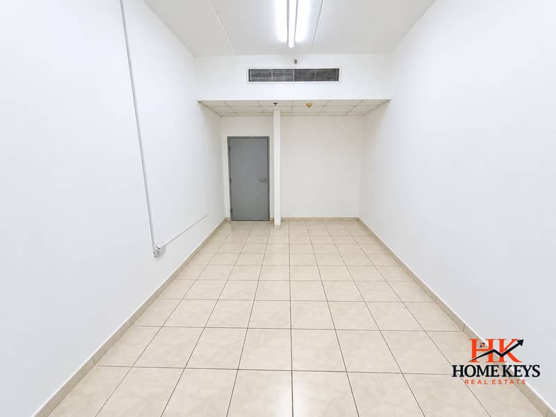 2 Empty White-Tiled Commercial Interior. png