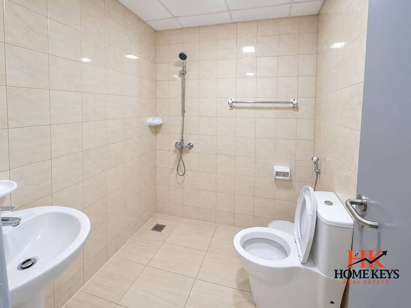 8 Modern Beige Tiled Wet-Room Bathroom. png