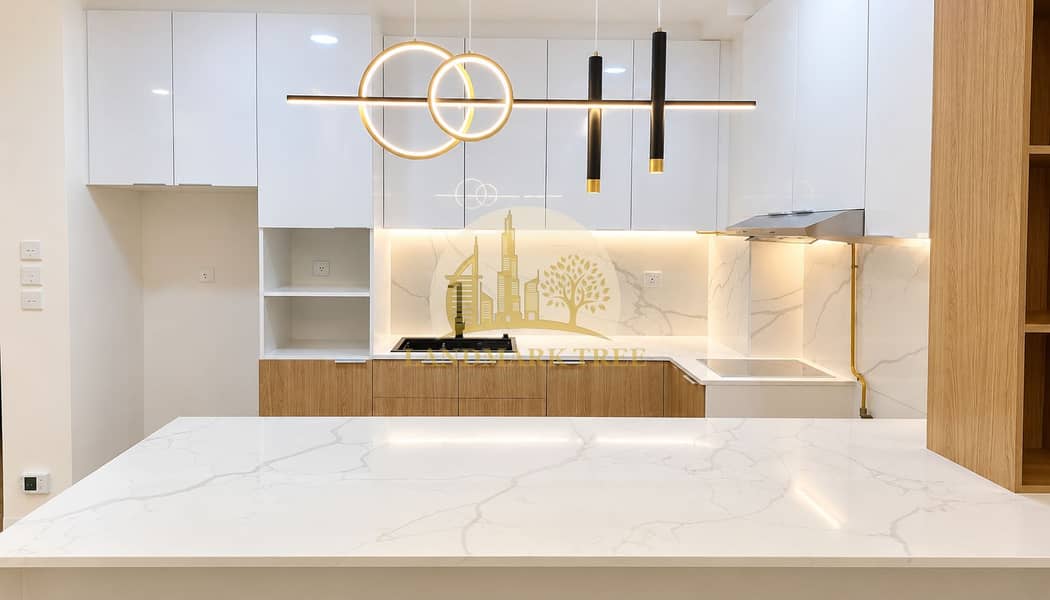 6 Modern Marble Kitchen with Designer Lighting. png