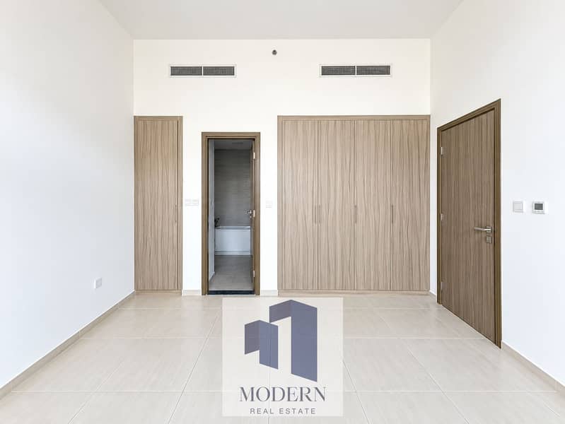 6 Minimalist Neutral Room with Built-In Storage. png