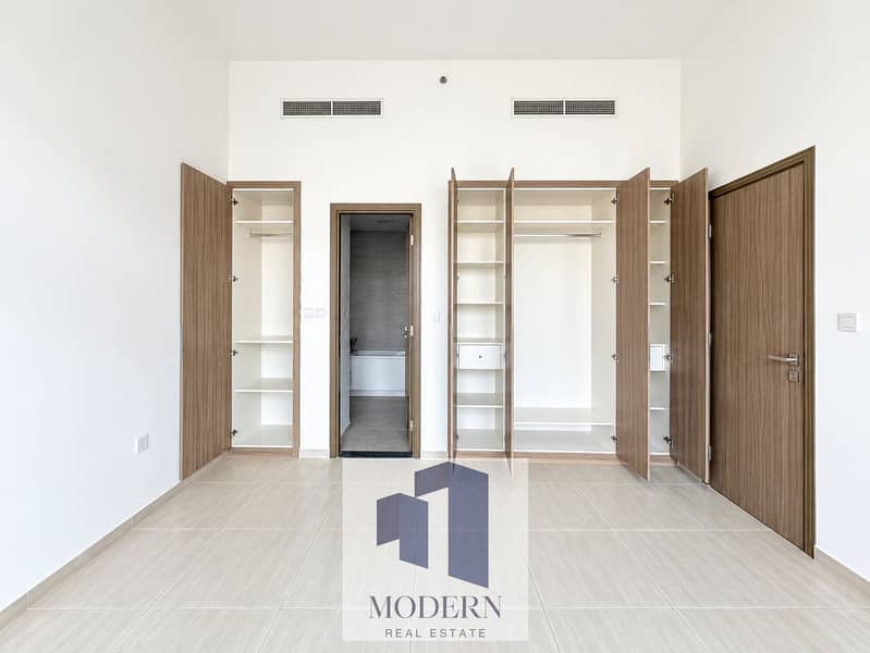 7 Minimalist Bedroom with Open Wardrobes. png