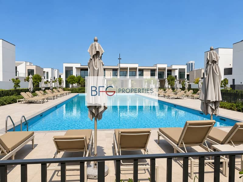 5 Natural community pool with sun loungers. png