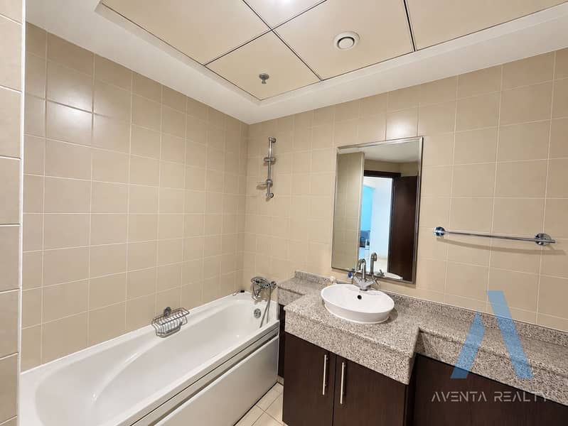 8 Modern Beige-Tiled Bathroom Interior. png