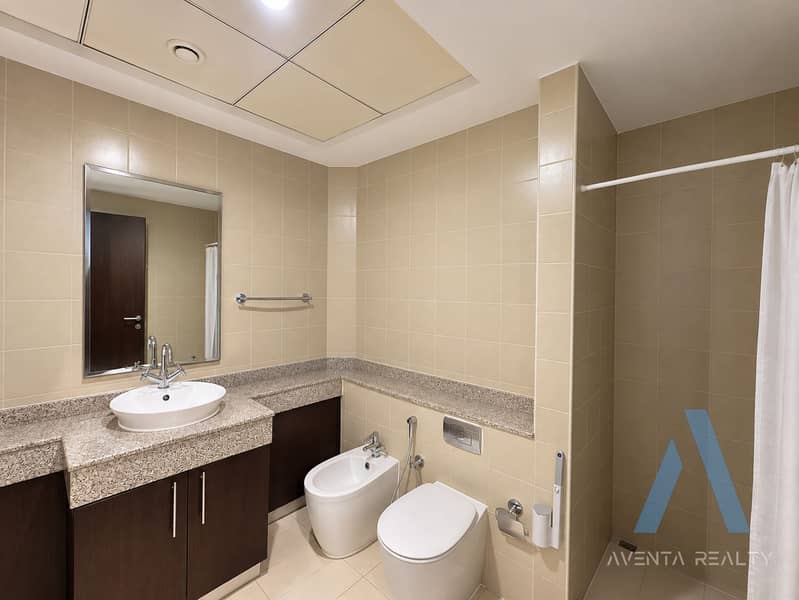 9 Modern Beige-Tiled Bathroom. png