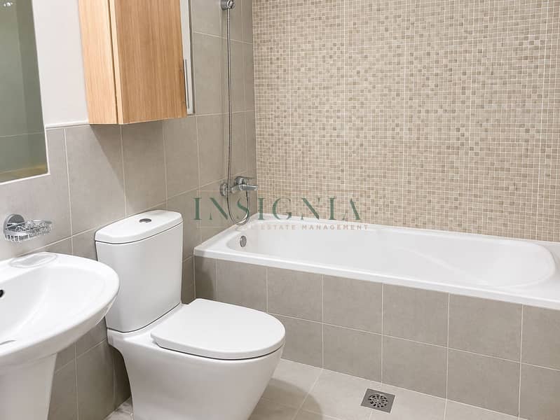 7 Modern Neutral-Tiled Bathroom. png